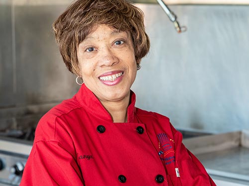 Woman chef in kitchen